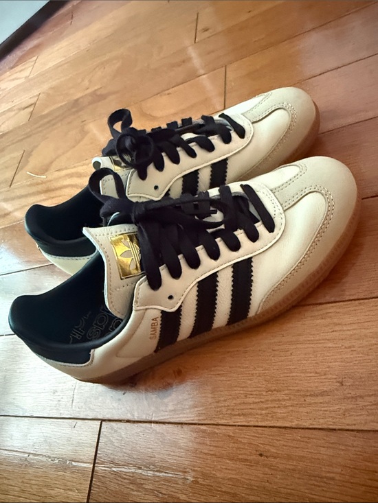 adidas Shoes - adidas Samba Sneakers in White and Black with Gold Tongue Detail